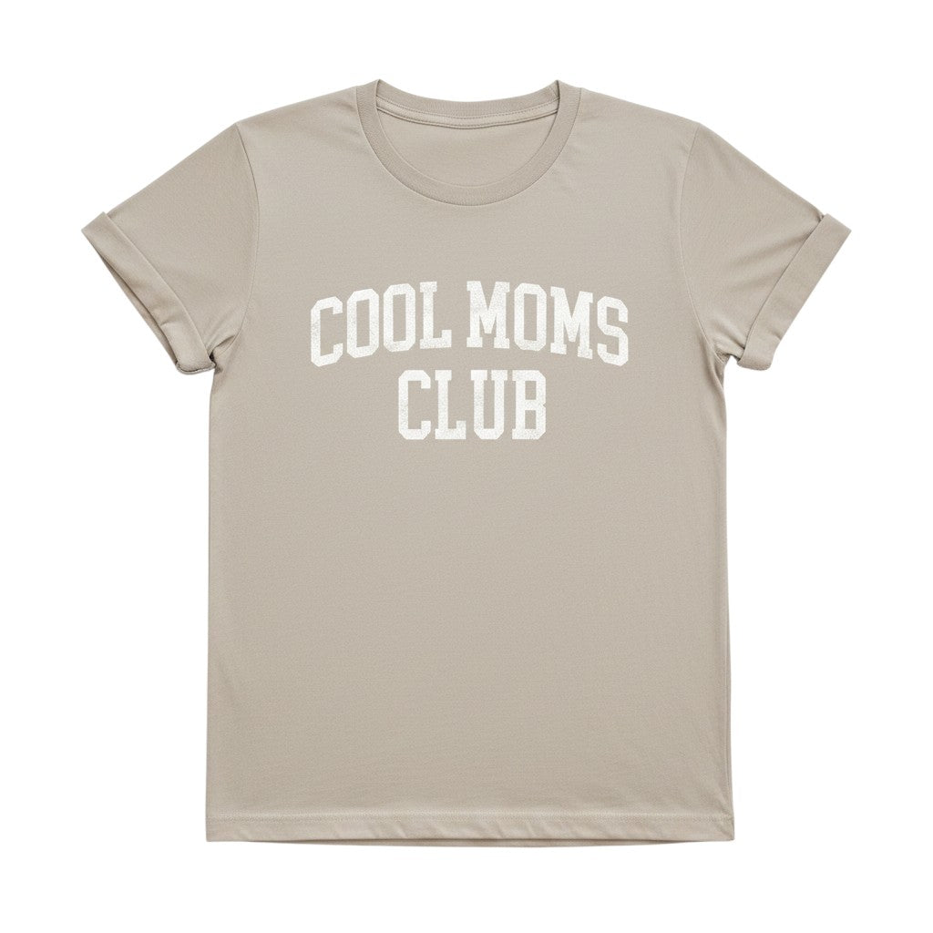 Mom & Me Boutique beige unisex graphic t-shirt with Cool Moms Club text in white, made from premium cotton.