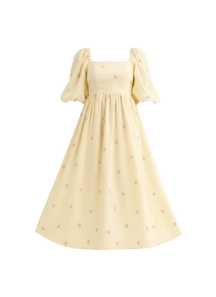 Mom & Me Boutique Betty midi dress in pale yellow cotton with smocked puff sleeves and delicate floral embroidery.