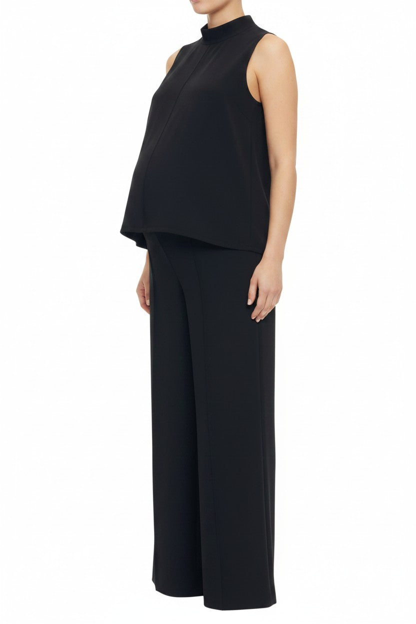Mom & Me Boutique black knit maternity set with sleeveless mock neck top and wide leg pants on a pregnant model