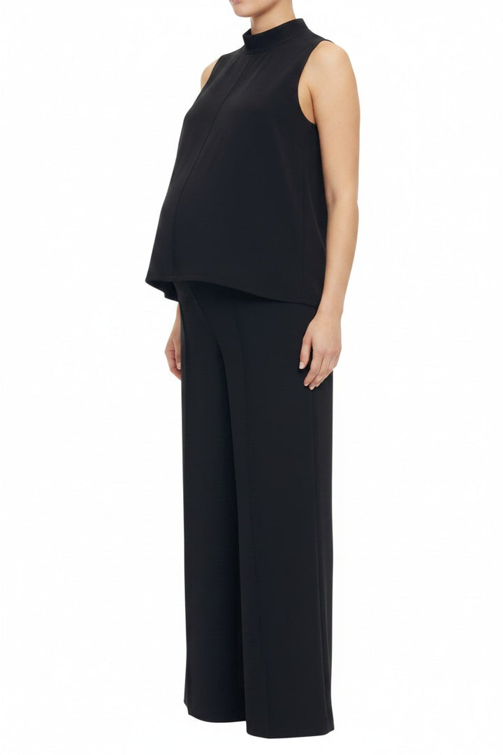 Mom & Me Boutique black knit maternity set with sleeveless mock neck top and wide leg pants on a pregnant model