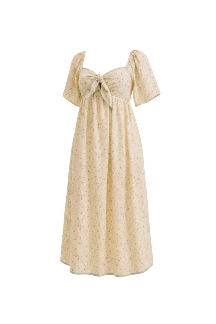 Mom & Me Boutique butter cream midi dress with sweetheart neckline, floral print, flutter sleeves, and tie front.