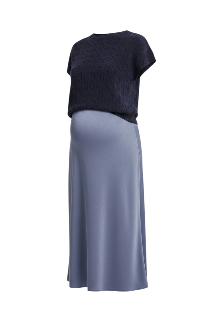 Mom & Me Boutique Elani twofer set featuring a navy cable knit sweater vest over a silver blue satin midi slip dress.