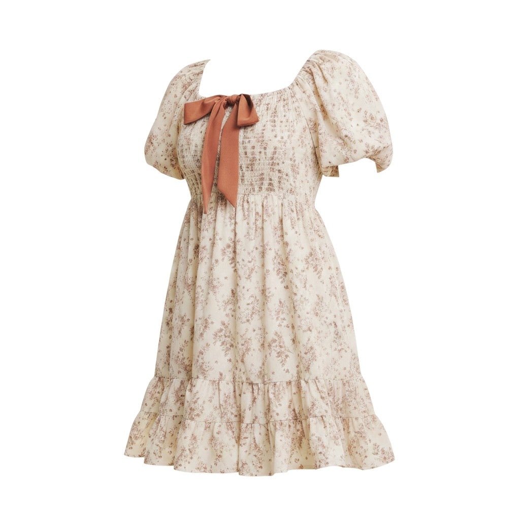 Mom & Me Boutique cream floral mini dress with square neck, bubble sleeves, and a contrast brown bow tie detail.