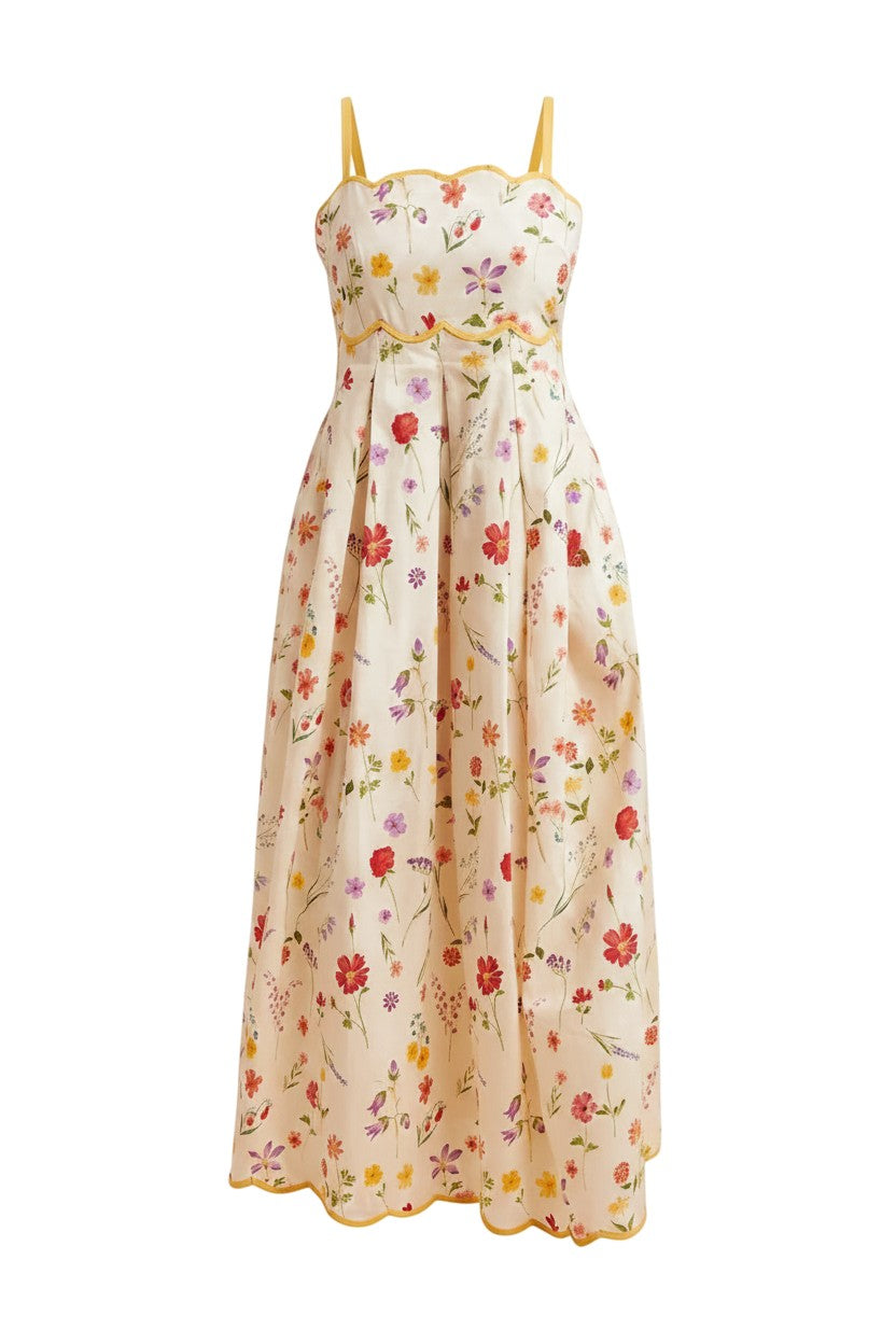 Mom & Me Boutique Elenie maxi dress in cream cotton with a colorful floral print and yellow scalloped trim details.