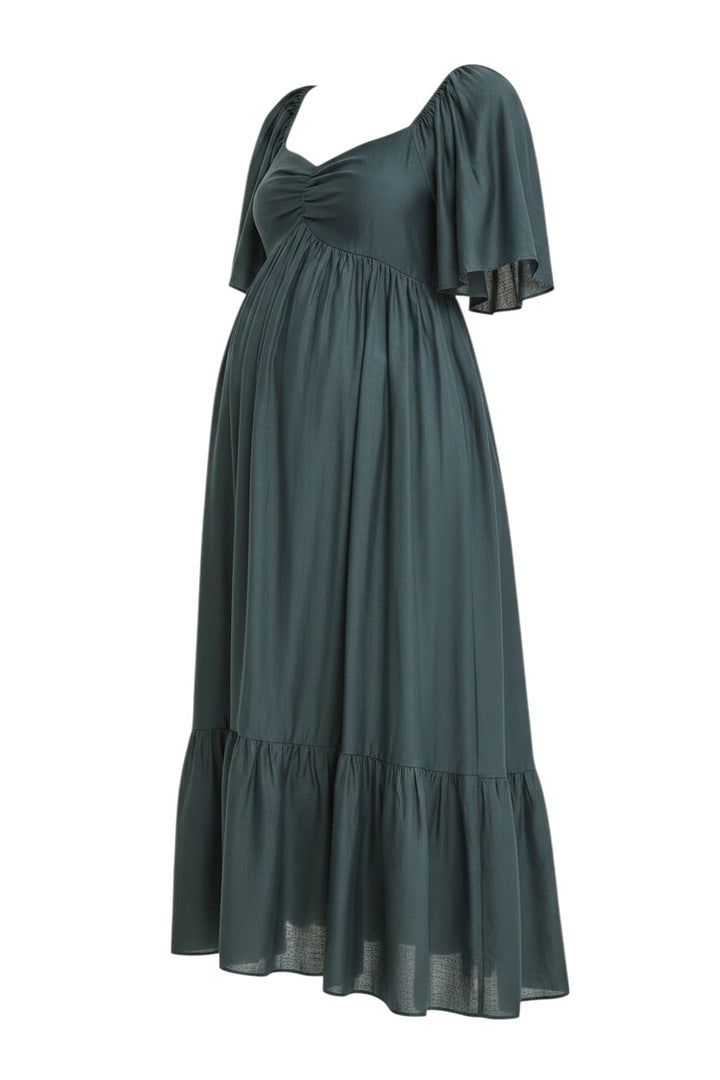 Mom & Me Boutique emerald green midi dress with sweetheart neckline, flutter sleeves, and smocked back detail.