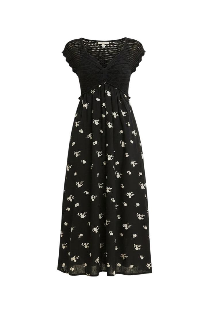 Mom & Me Boutique Emery black midi dress featuring a crochet sweater top and a floral embroidered cotton skirt.