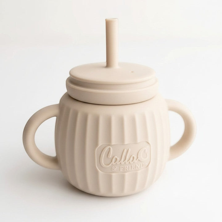 Mom & Me Boutique fawn silicone Brody Cup with straw, handles, and ribbed texture for easy grip.