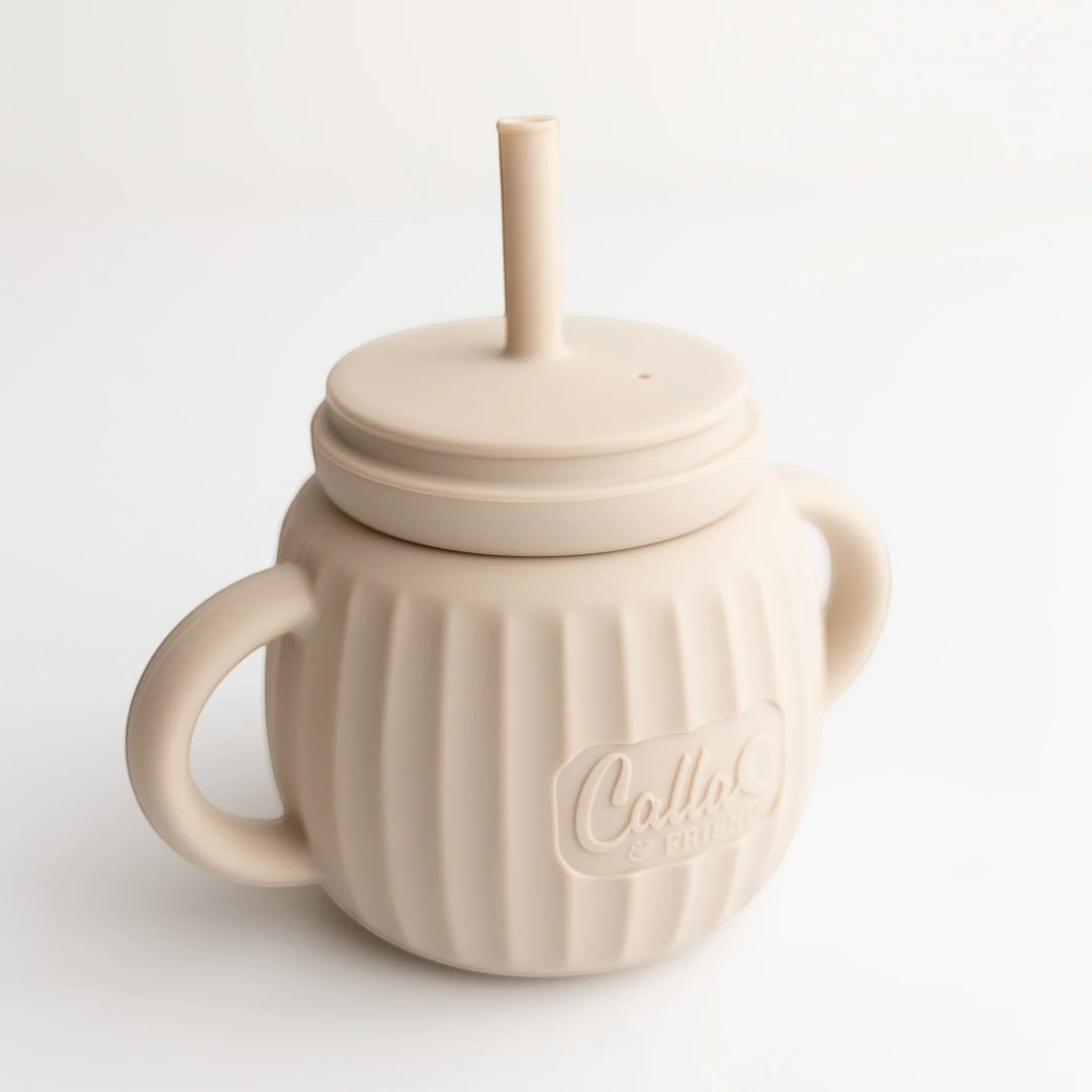 Mom & Me Boutique fawn silicone Brody Cup with straw, dual handles, and ribbed texture for easy toddler gripping.