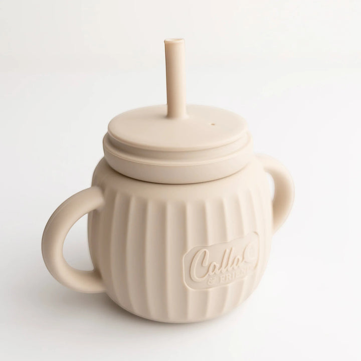 Mom & Me Boutique fawn silicone Brody Cup with straw, dual handles, and ribbed texture for easy toddler gripping.