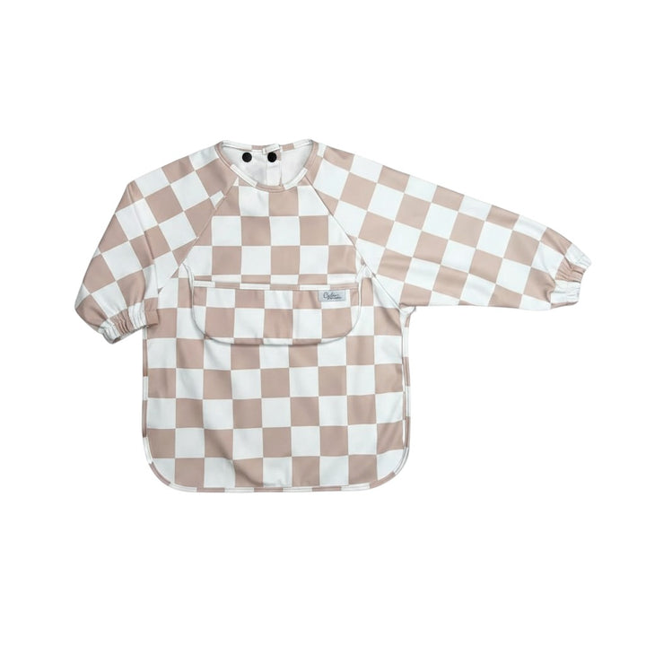 Mom & Me Boutique Grayson long sleeve waterproof baby bib in a beige and white checkered pattern with a catch-all pocket