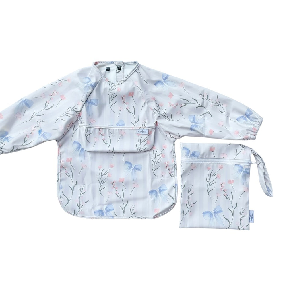 Mom & Me Boutique Grayson long sleeve waterproof baby bib with floral and blue bow print, includes matching wet bag.