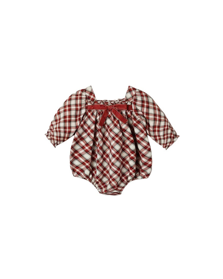 Mom & Me Boutique Annette romper in red and white holiday tartan with long sleeves and a velvet bow detail.