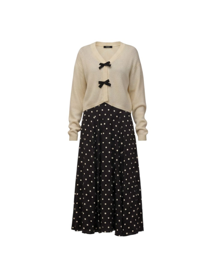 Mom & Me Boutique ivory knit cardigan with black bow details paired with a black polka dot midi skirt