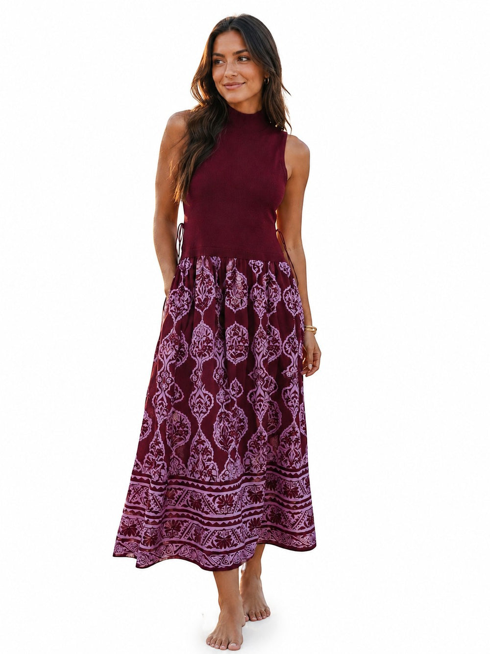 Mom & Me Boutique Izabella burgundy midi dress with a sleeveless mock neck top and patterned skirt with pockets.