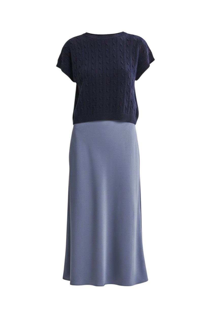 Mom & Me Boutique Elani twofer set featuring a navy cable knit sweater vest over a silver blue satin midi slip dress.