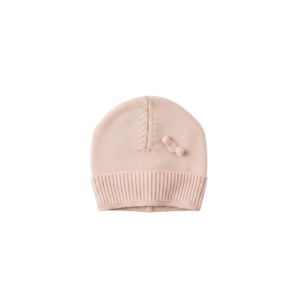 Mom & Me Boutique soft pink organic cotton knit baby beanie with a classic round fit and delicate bow detail.