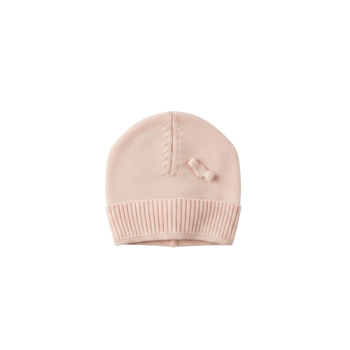 Mom & Me Boutique soft pink organic cotton knit baby beanie with a classic round fit and delicate bow detail.