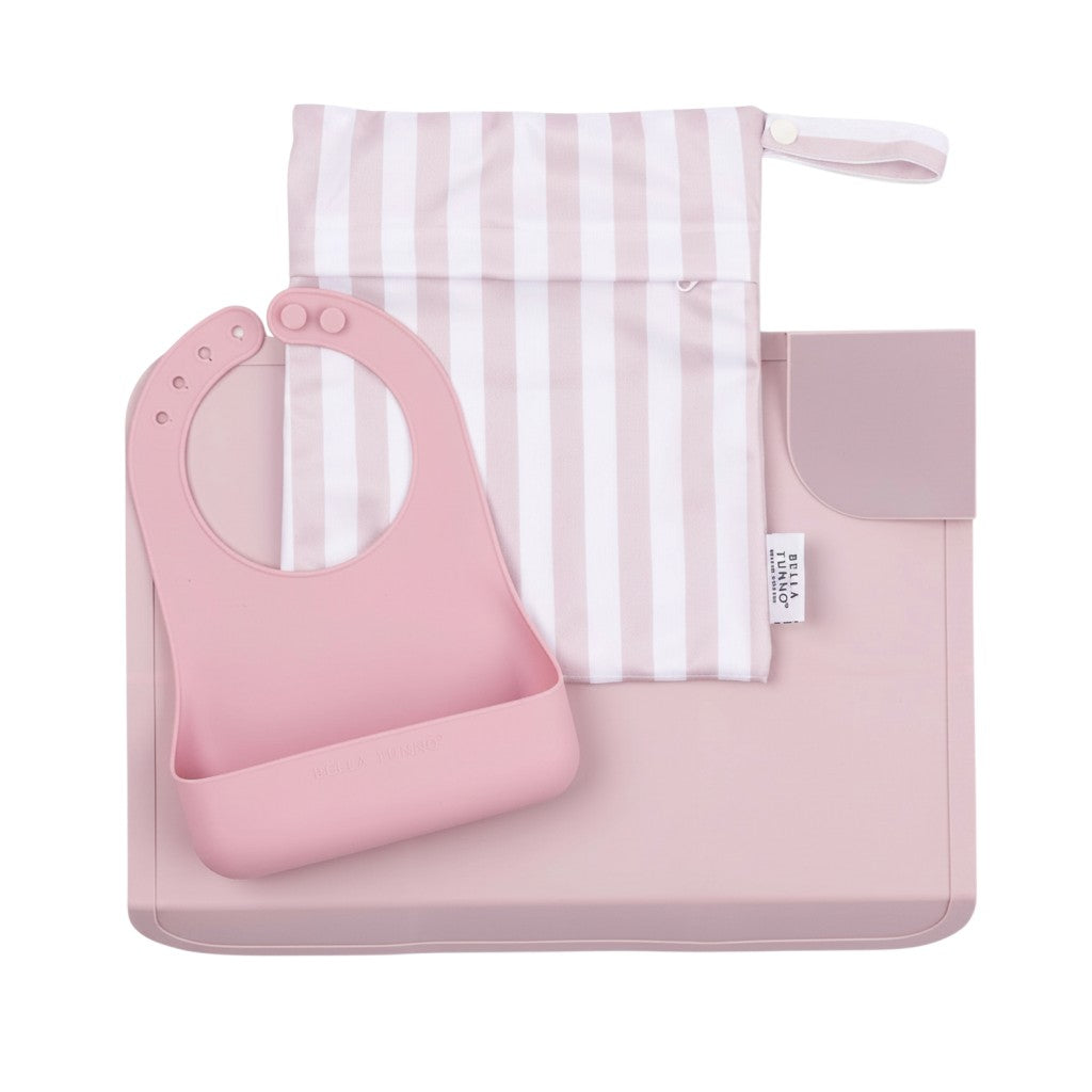 Mom & Me Boutique Pack and Go Bundle in Magic Meadow pink featuring a silicone bib, foldable placemat, and wet bag.