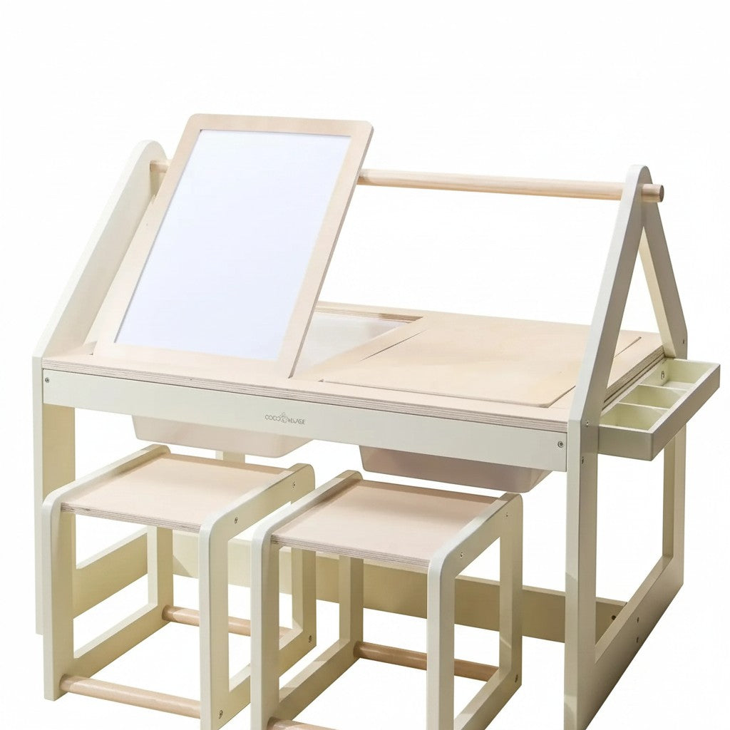 Mom & Me Boutique wooden art and sensory table with two stools, whiteboard, and storage bins for creative play.
