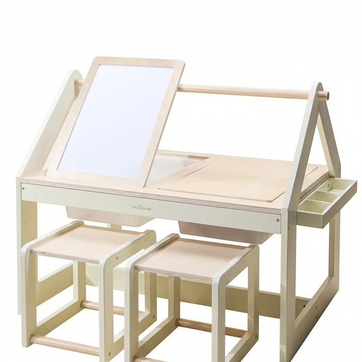 Mom & Me Boutique wooden art and sensory table with two stools, whiteboard, and storage bins for creative play.