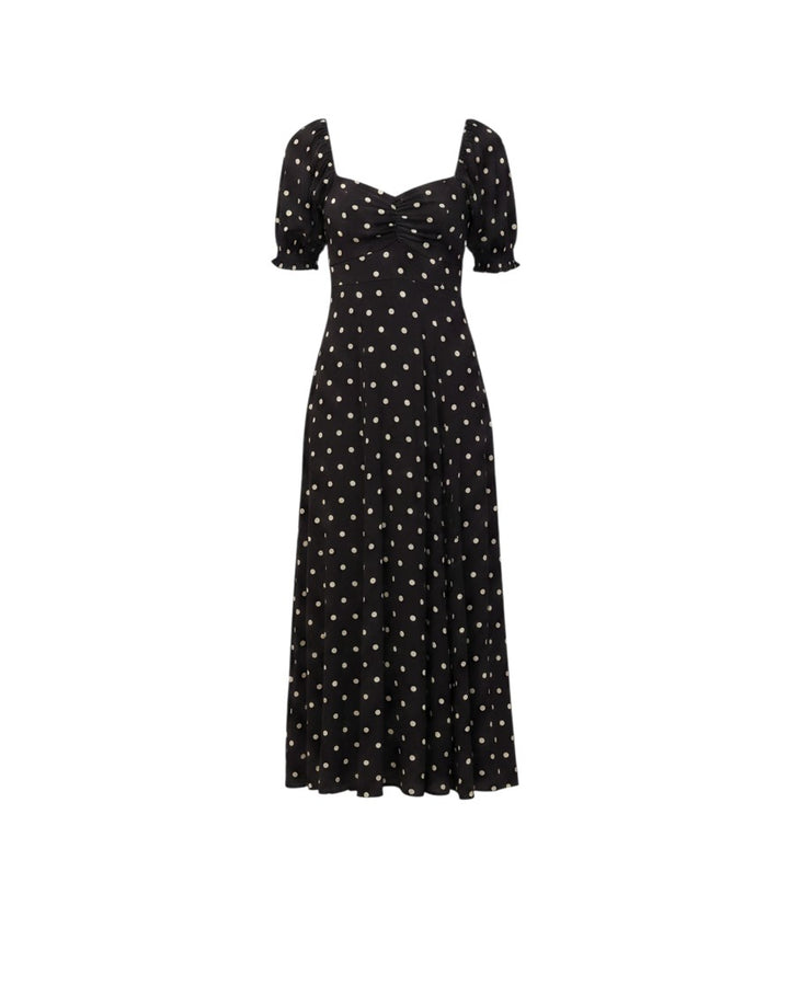 Mom & Me Boutique Zoe midi dress in black with white polka dots, featuring a sweetheart neckline and puff sleeves.